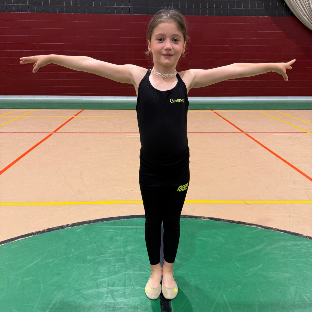 Gymnast in black leggings and leotard