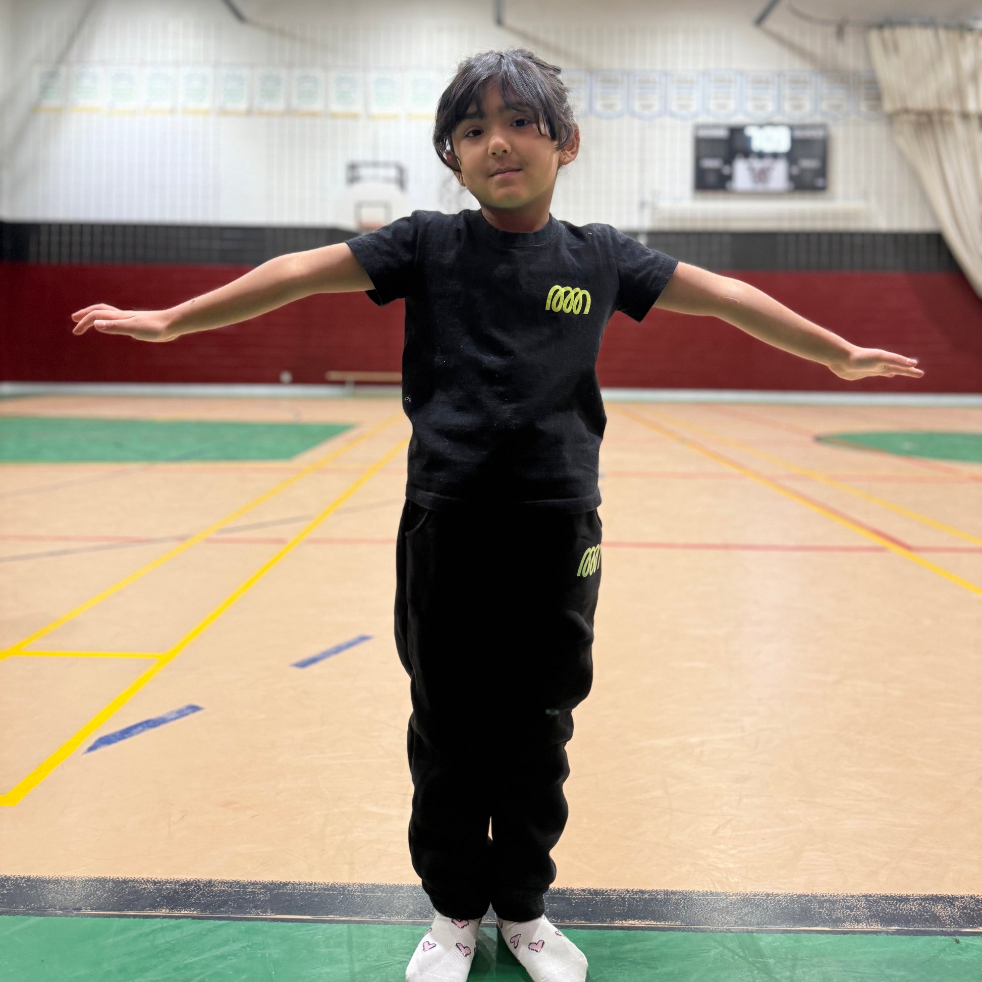 Gymnast wearing Gemmez brand jogger and t-shirt