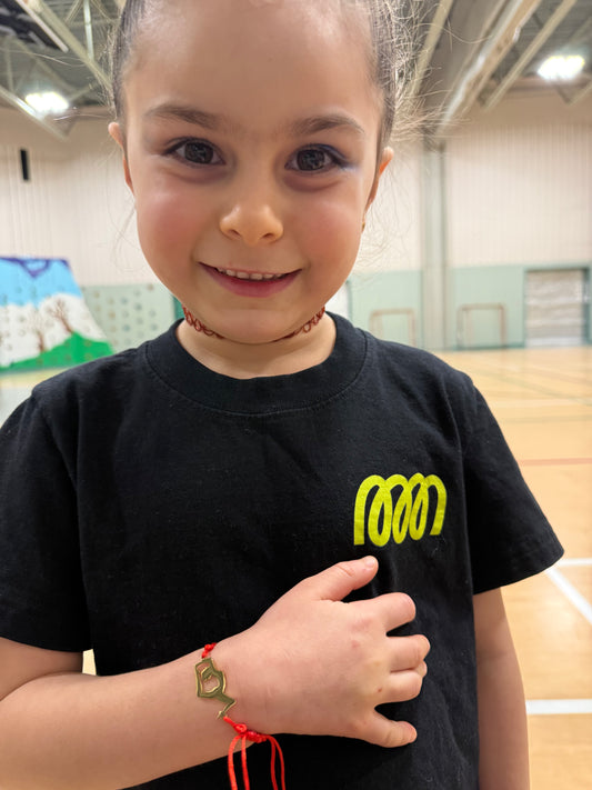 Gymnast wearing red gymnast bracelet
