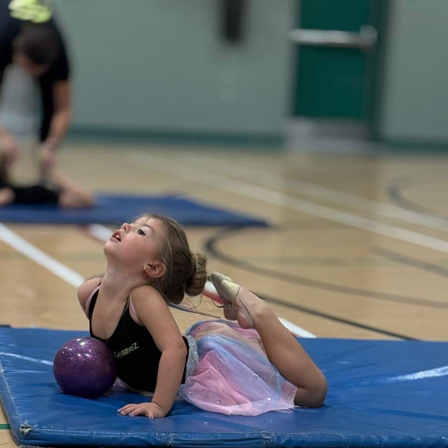 Young gymnast in ring position