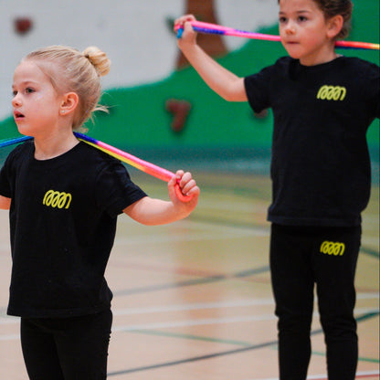 Young gymnasts wearing Gemmez branded leggings training with ropes