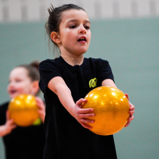 gymnast with gold ball